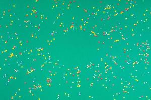 Christmas pattern green paper colorful confetti photo