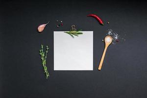 Blank notepad pages with greens herbs and spices photo