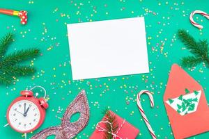 Christmas pattern flat lay with red alarm clock photo