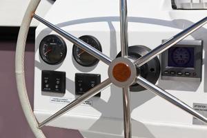 Sailing yacht control wheel and implement. photo