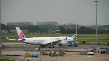 AMSTERDAM, THE NETHERLANDS JULY 29, 2017 - China Airlines Airbus A350 B 18907 towing before departure, Shiphol Airport, Amsterdam, Holland video