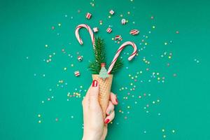 Christmas card with candy canes in waffle cone photo