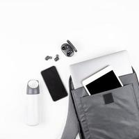 Modern backpack with laptop and tablet inside photo