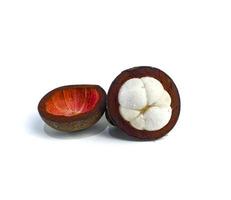 Mangosteen and cross section showing the thick purple skin and white flesh of the queen of friuts, on white background photo