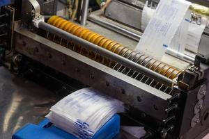 A closeup shot of a machine printing syringe labels at a medical production warehouse photo