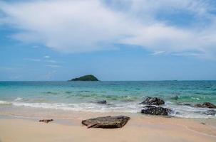 Landscape summer front view  tropical sea beach rock blue white sand background calm Nature ocean Beautiful wave crash splashing water travel Nang Ram Beach East thailand Chonburi Exotic horizon. photo