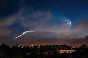 Soyuz space rocket launch. Space jellyfish in sky. Plume of rocket gases in sun at dawn. photo