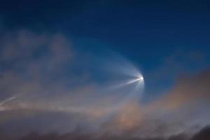 Soyuz space rocket launch. Space jellyfish in sky. Plume of rocket gases in sun at dawn. photo