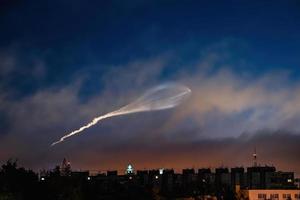 Soyuz space rocket launch. Space jellyfish in sky. Plume of rocket gases in sun at dawn. photo