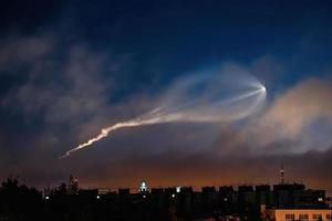 Soyuz space rocket launch. Space jellyfish in sky. Plume of rocket gases in sun at dawn. photo