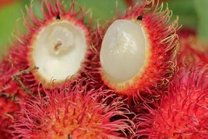 Rambutan Fruit with delicious core on wooden table photo