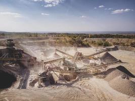 Crushed stone quarry machine at work. photo