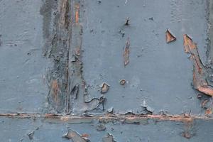 Close up at vintage peeling paint on wooden surfaces photo