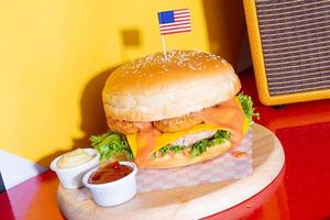 jumbo or giant burger - pork with cheese and fried nugget burger photo