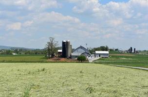 Beautiful Breathtaking Farmland with a Barn Surrounded By Fields photo