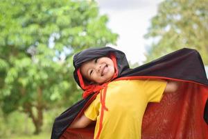 Happy kid in halloween costumes. halloween holiday concept photo