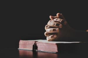 Young woman person hand holding holy bible with study at home. Adult female christian reading book in church. Girl learning religion spirituality with pray to god. concept of student education faith. photo