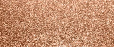 Abstract blur rose gold glitter sparkle defocused bokeh light background photo