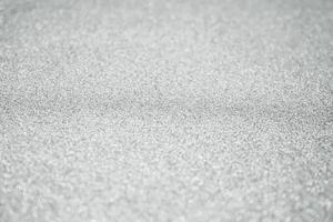 Abstract blur silver glitter sparkle defocused bokeh light background photo