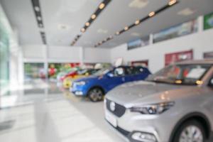 new cars in showroom blurred defocused background photo