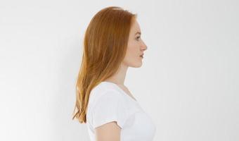 Profile portrait of red haired caucasian girl with long and shiny straight female hair isolated on white background . Beautiful woman european model with straight hairstyle. Copy space. Banner photo