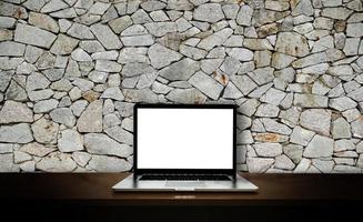 Modern laptop  isolated on rock background. 3D illustration. photo