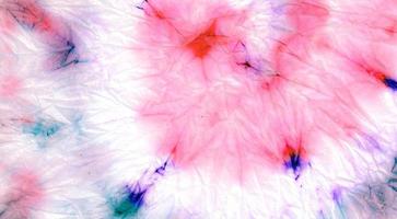 Pink Spiral Tie Dye. Dyed Circular Background. photo