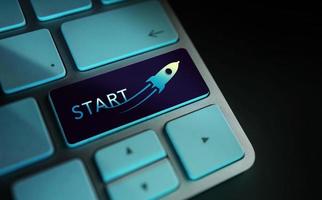 Start, Challenge, Start-Up and Motivation Concept. Close Up of Rocket and Startup Sign on Computer Keyboard. Dark tone photo