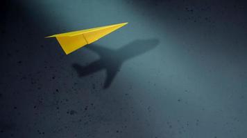 Think Big and Motivation in Business Concept. Paper AirPlanes Flying with Shadow of Aircraft over the Wall photo