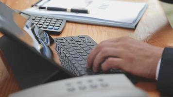 Businessman working with smart phone and laptop and digital tablet computer in office with digital marketing media in virtual icon video