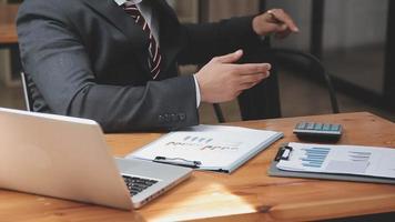 Businessman working with smart phone and laptop and digital tablet computer in office with digital marketing media in virtual icon video