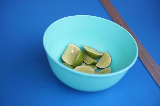 Slices of lime in a plastic container are usually used to add to the deliciousness of the soto rice. photo