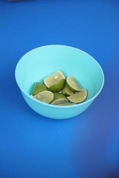 Slices of lime in a plastic container are usually used to add to the deliciousness of the soto rice. photo