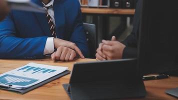 Businessman working with smart phone and laptop and digital tablet computer in office with digital marketing media in virtual icon video