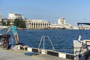 Yalta, Crimea-June 12, 2021 Cityscape with a sea mooring photo