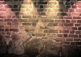 Aged and weathered brick wall textures with very bright spotlight illumination photo