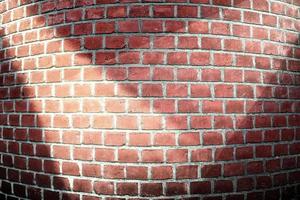 Aged and weathered brick wall textures with very bright spotlight illumination photo