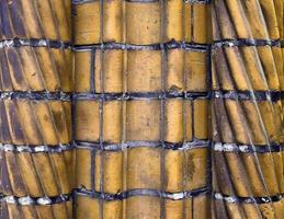 Detailed view at a colorful old and weathered brick wall texture as a panoramic background. photo