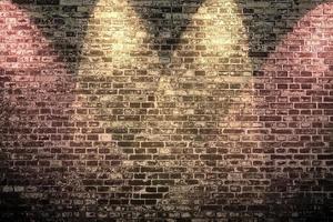 Aged and weathered brick wall textures with very bright spotlight illumination photo