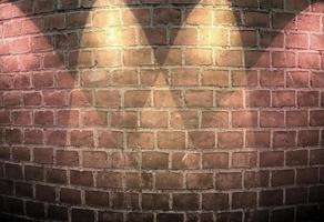 Aged and weathered brick wall textures with very bright spotlight illumination photo