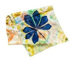 folded scarf with hand-drawn blue chestnut leaf photo