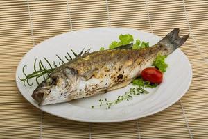 Grilled seabass on wood photo