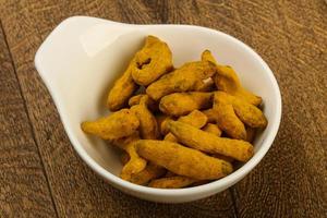 Tumeric roots dish view photo