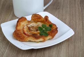 Apple pastry on wood photo