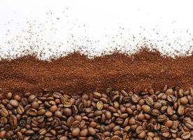 Coffee beans and ground coffee on a white background. The photo shows coffee grains and ground coffee on a white background, photo for the background.