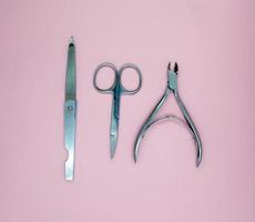 Nail file, scissors and nail clippers photo