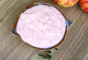 Strawberry yoghurt on wood photo