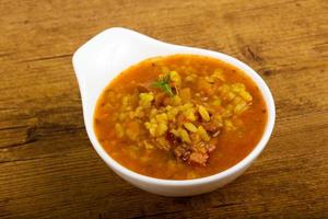 Kharcho soup in a bowl on wooden background photo