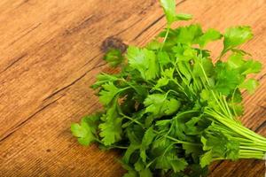 Parsley on wooden background photo