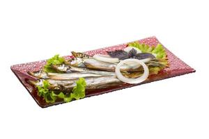 Dried Capelin on white photo